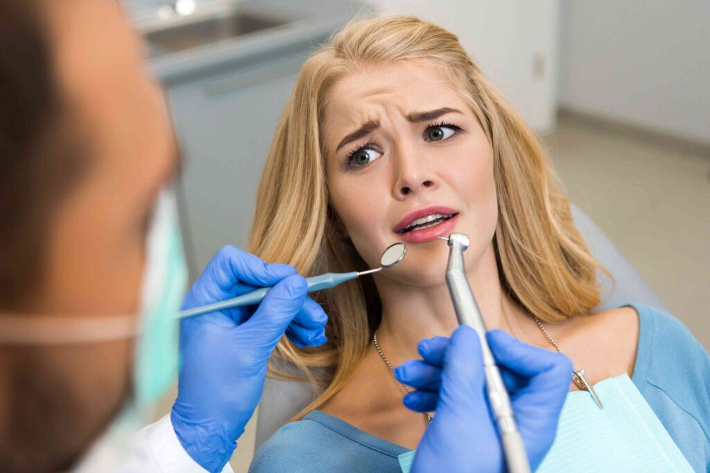 Patient with a cracked tooth during a dental exam.